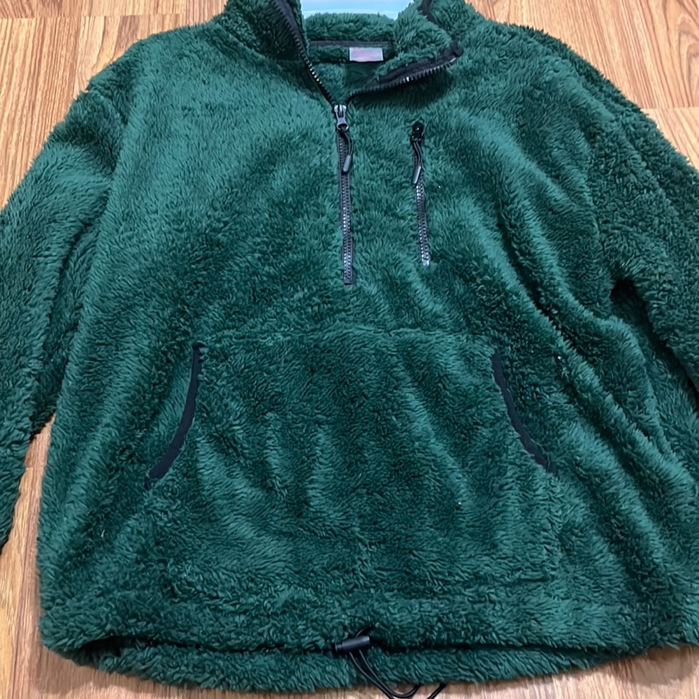 Green fluffy jacket nice for the upcoming fall weather .